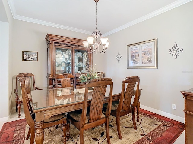 dining room featuring ornamental molding and a notable chandelier