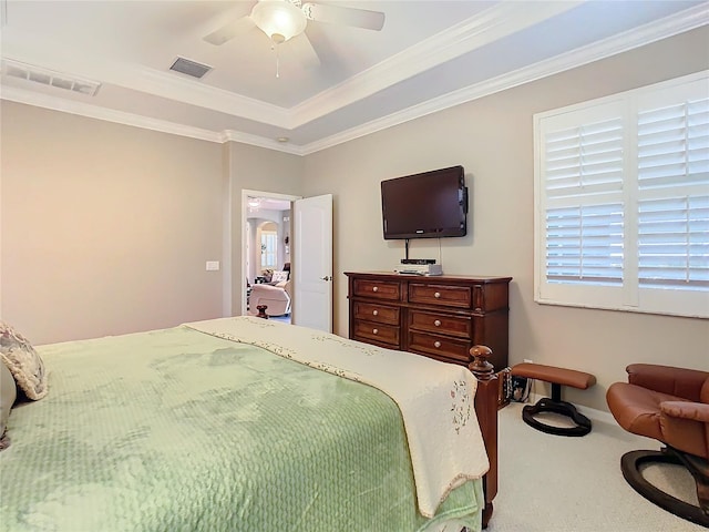 carpeted bedroom with ceiling fan and crown molding