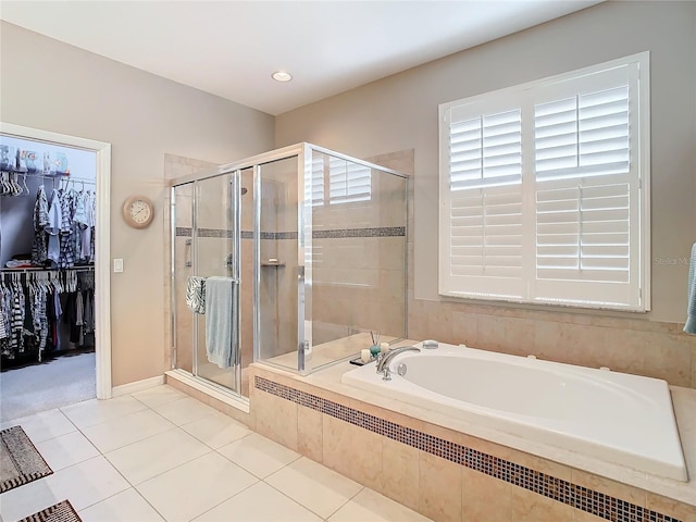 bathroom featuring shower with separate bathtub and tile patterned floors