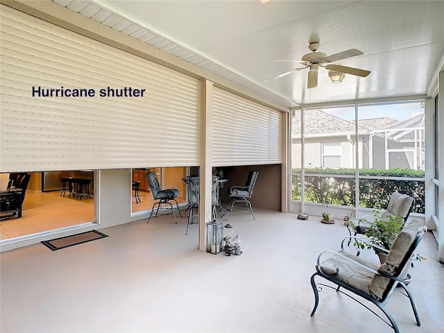 sunroom / solarium with ceiling fan