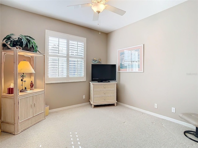 sitting room with carpet floors and ceiling fan