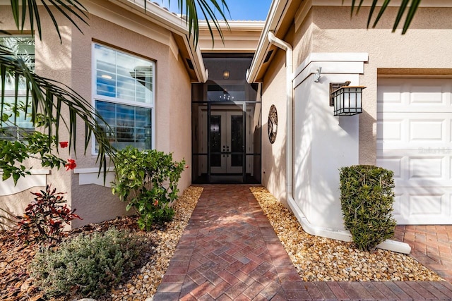 property entrance with french doors and a garage