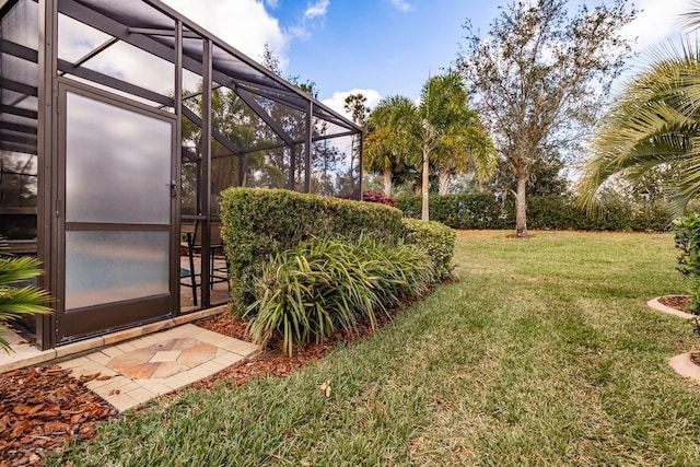 view of yard featuring glass enclosure