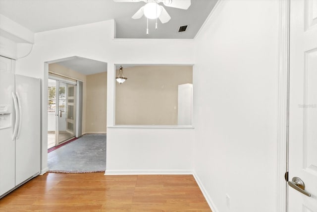 interior space featuring light wood-type flooring and ceiling fan