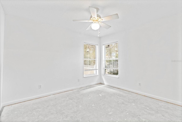 spare room with concrete flooring and ceiling fan