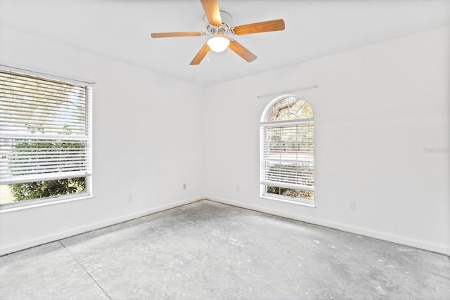 unfurnished room with ceiling fan