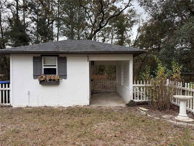 view of side of property with a lawn