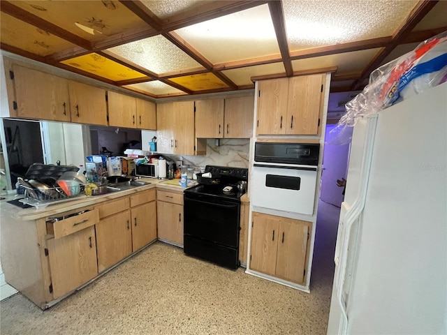 kitchen with light brown cabinets and white appliances