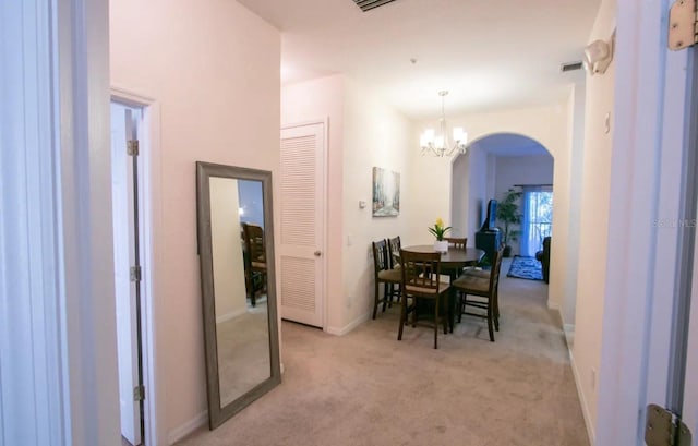 606 Gran Bahama Blvd Unit 29-606, Davenport, FL 33897 - dining space with arched walkways, a chandelier, and light colored carpet