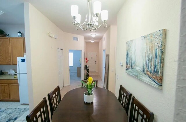 606 Gran Bahama Blvd Unit 29-606, Davenport, FL 33897 - dining area featuring a chandelier and light tile patterned floors