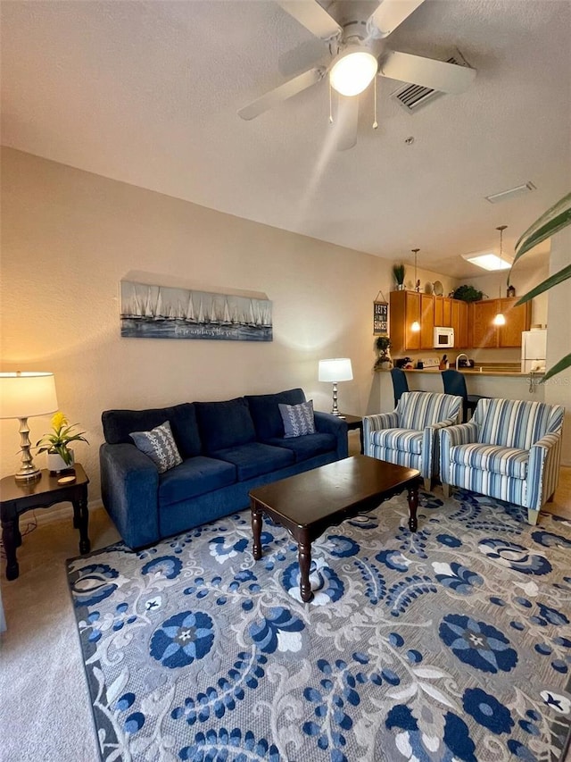606 Gran Bahama Blvd Unit 29-606, Davenport, FL 33897 - carpeted living area with a ceiling fan and a textured ceiling