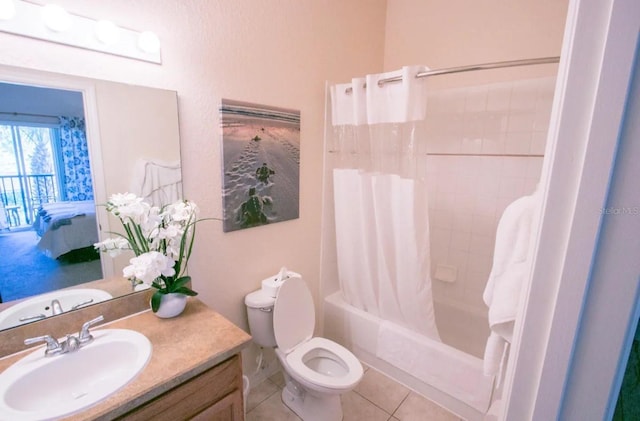 606 Gran Bahama Blvd Unit 29-606, Davenport, FL 33897 - bathroom featuring vanity, shower / bath combo with shower curtain, tile patterned floors, and ensuite bathroom