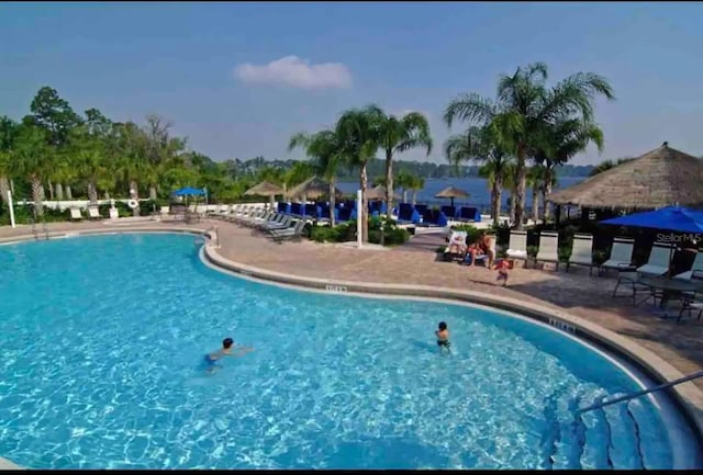 606 Gran Bahama Blvd Unit 29-606, Davenport, FL 33897 - community pool featuring a patio area