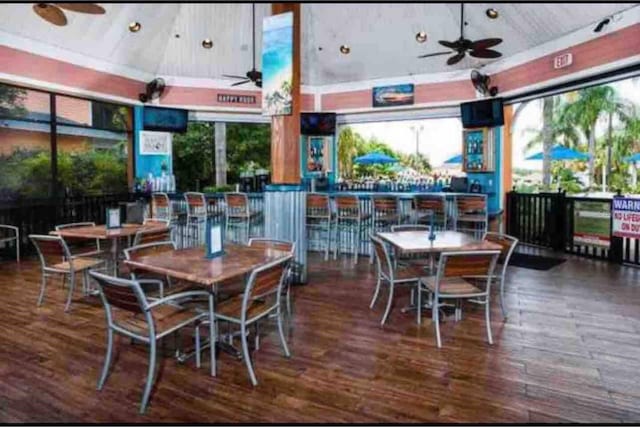 606 Gran Bahama Blvd Unit 29-606, Davenport, FL 33897 - dining space featuring a ceiling fan, wood finished floors, and a high ceiling