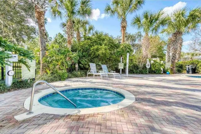 606 Gran Bahama Blvd Unit 29-606, Davenport, FL 33897 - view of swimming pool featuring a hot tub and a patio