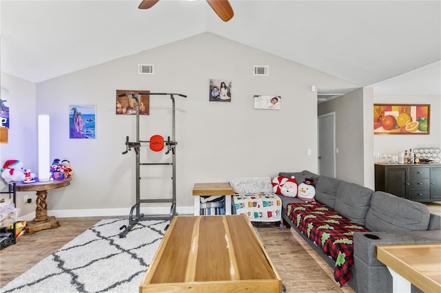 playroom featuring light wood-type flooring, ceiling fan, and lofted ceiling