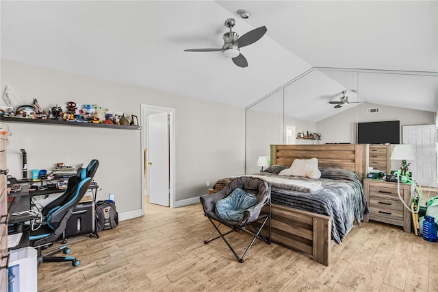 bedroom featuring light hardwood / wood-style floors, ceiling fan, and lofted ceiling