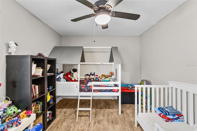 bedroom with hardwood / wood-style floors and ceiling fan