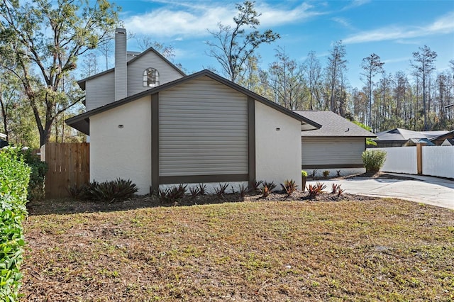 view of side of home featuring a yard