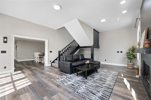 living room with dark hardwood / wood-style floors