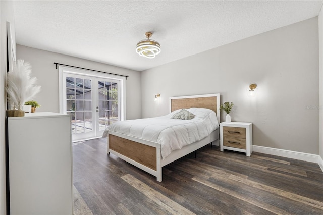 bedroom with dark hardwood / wood-style flooring, access to exterior, french doors, and a textured ceiling