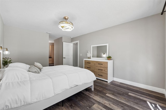 bedroom featuring dark hardwood / wood-style flooring