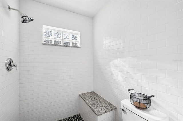 bathroom with a tile shower