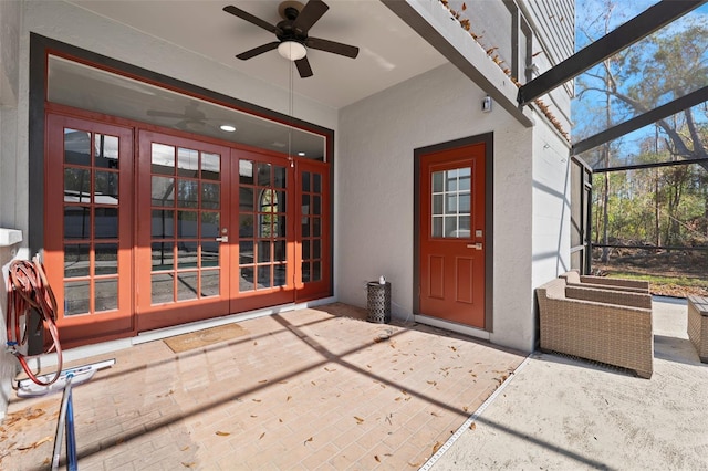 property entrance with french doors, a patio, and ceiling fan