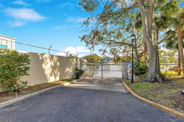 view of gate featuring a water view