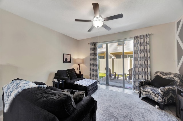 tiled living room with ceiling fan