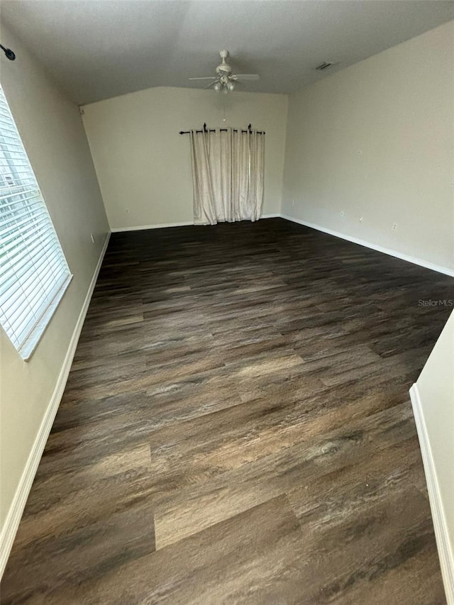 spare room featuring ceiling fan and dark hardwood / wood-style flooring