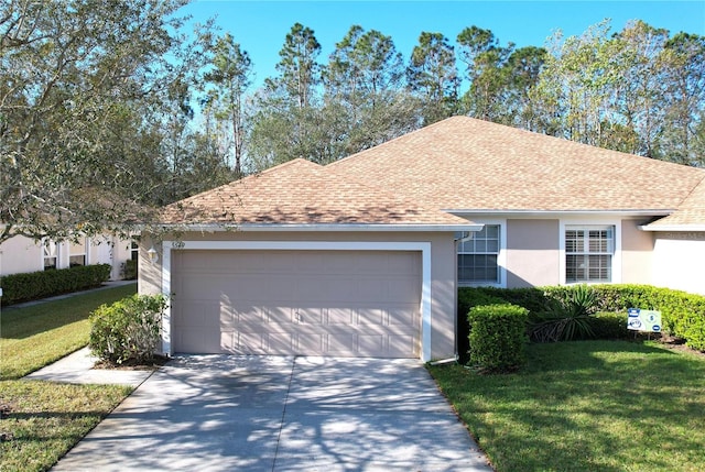 ranch-style house with a front lawn and a garage