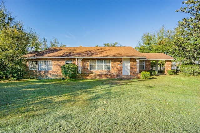 ranch-style home with a front lawn