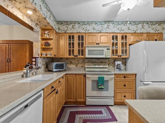 kitchen with ceiling fan, light tile patterned flooring, white appliances, and sink