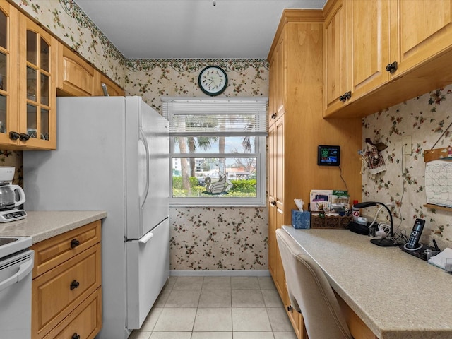 kitchen with white appliances and light tile patterned floors