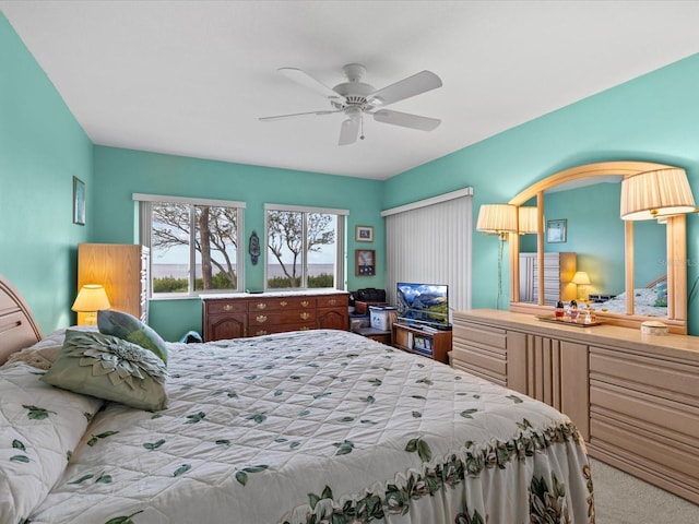 carpeted bedroom with ceiling fan