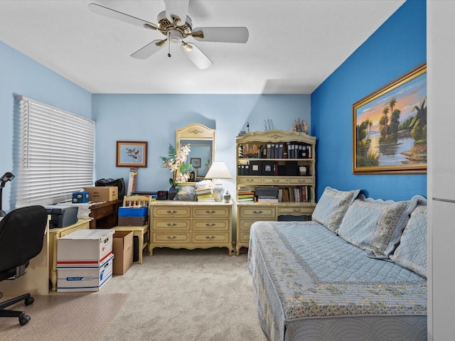 office space featuring light carpet and ceiling fan