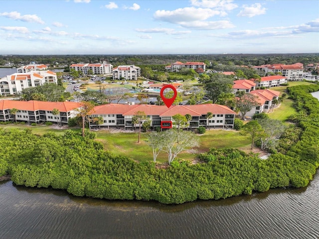 birds eye view of property featuring a water view