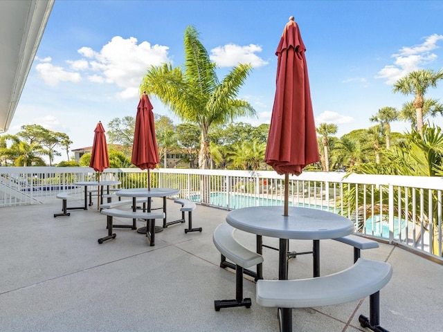 view of patio with a fenced in pool