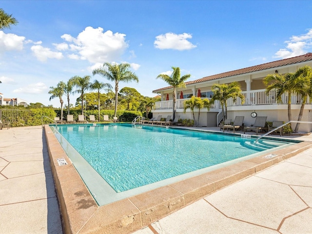 view of swimming pool with a patio