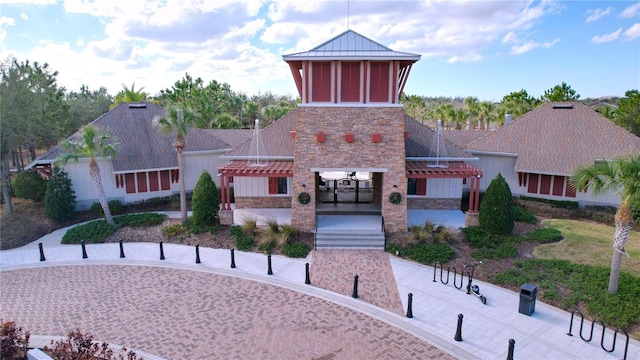 view of front facade with a patio area and a pergola