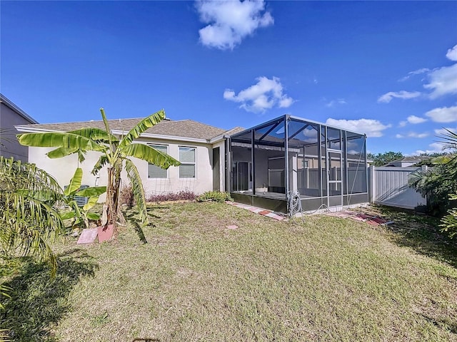 view of yard featuring glass enclosure