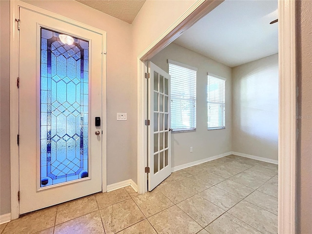 view of tiled foyer entrance