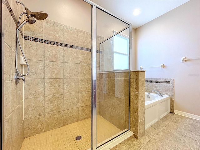 bathroom featuring tile patterned flooring and shower with separate bathtub