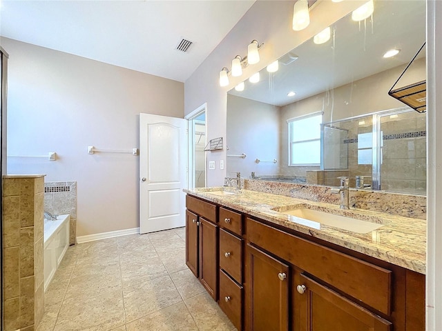 bathroom with plus walk in shower, tile patterned flooring, and vanity