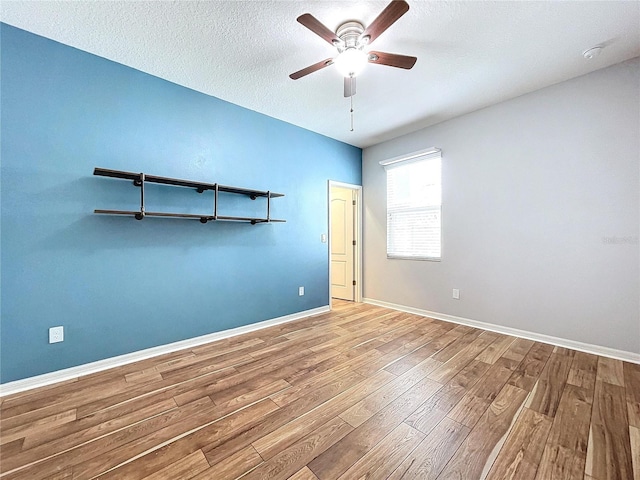 unfurnished bedroom featuring a textured ceiling, ceiling fan, and light hardwood / wood-style flooring