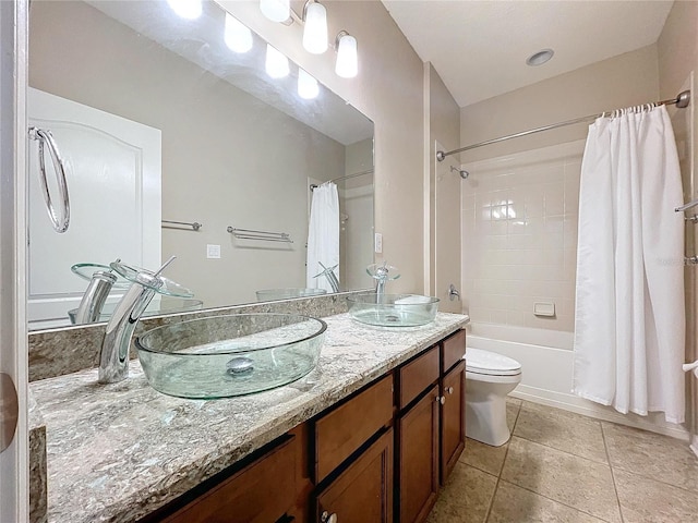 full bathroom featuring toilet, shower / tub combo, tile patterned floors, and vanity