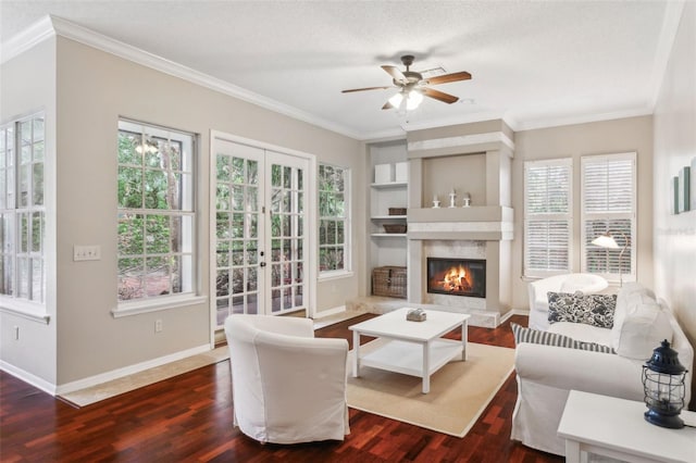 living room featuring crown molding, dark wood-type flooring, and built in features