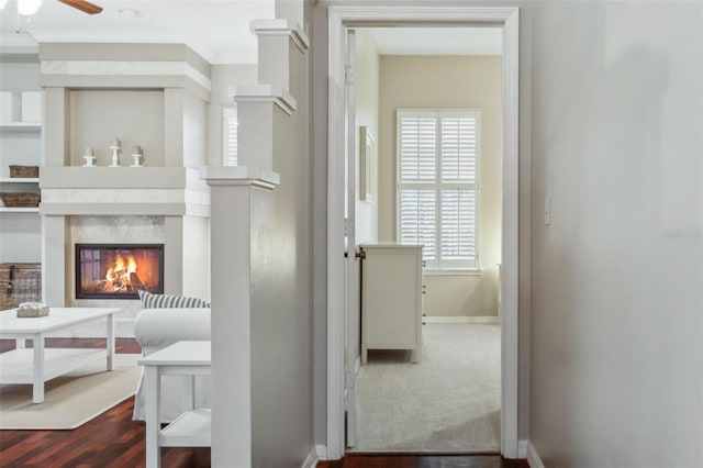 hall featuring hardwood / wood-style flooring and crown molding