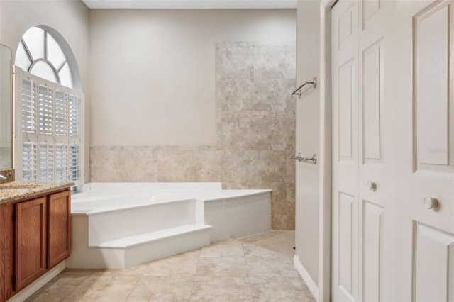 bathroom featuring tile walls, vanity, tile patterned flooring, and separate shower and tub